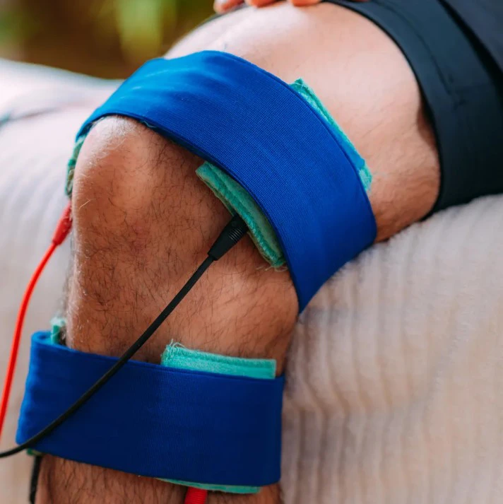 A patient receiving HakoMed treatment on their knee